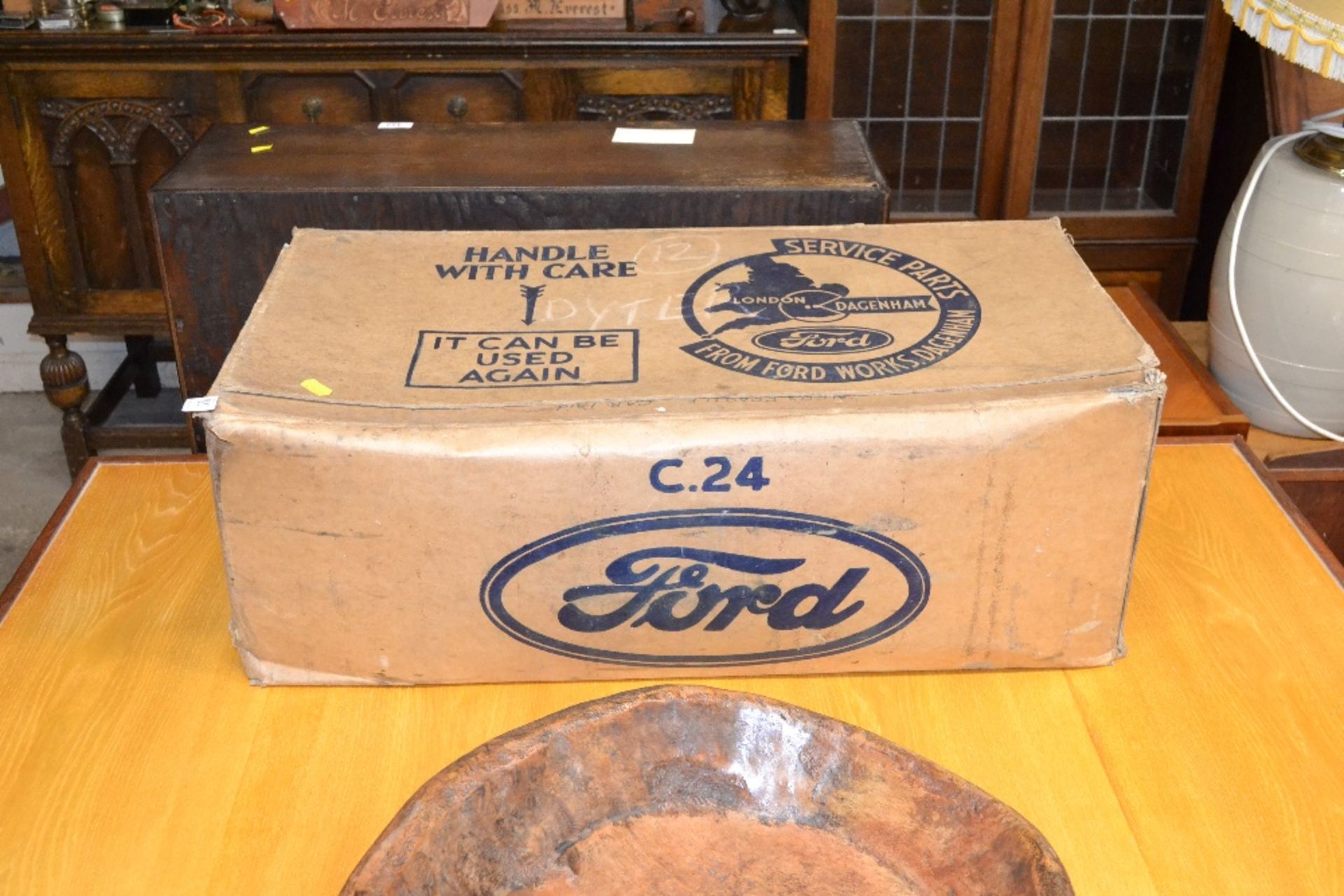 A vintage Ford parts box bearing labels