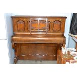 A mahogany cased upright piano