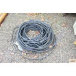 A quantity of garden flowerbed irrigation piping