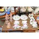 A quantity of crested china; floral wall plaques;