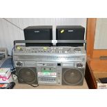 An Hitachi stereo/radio/cassette recorder and a pa