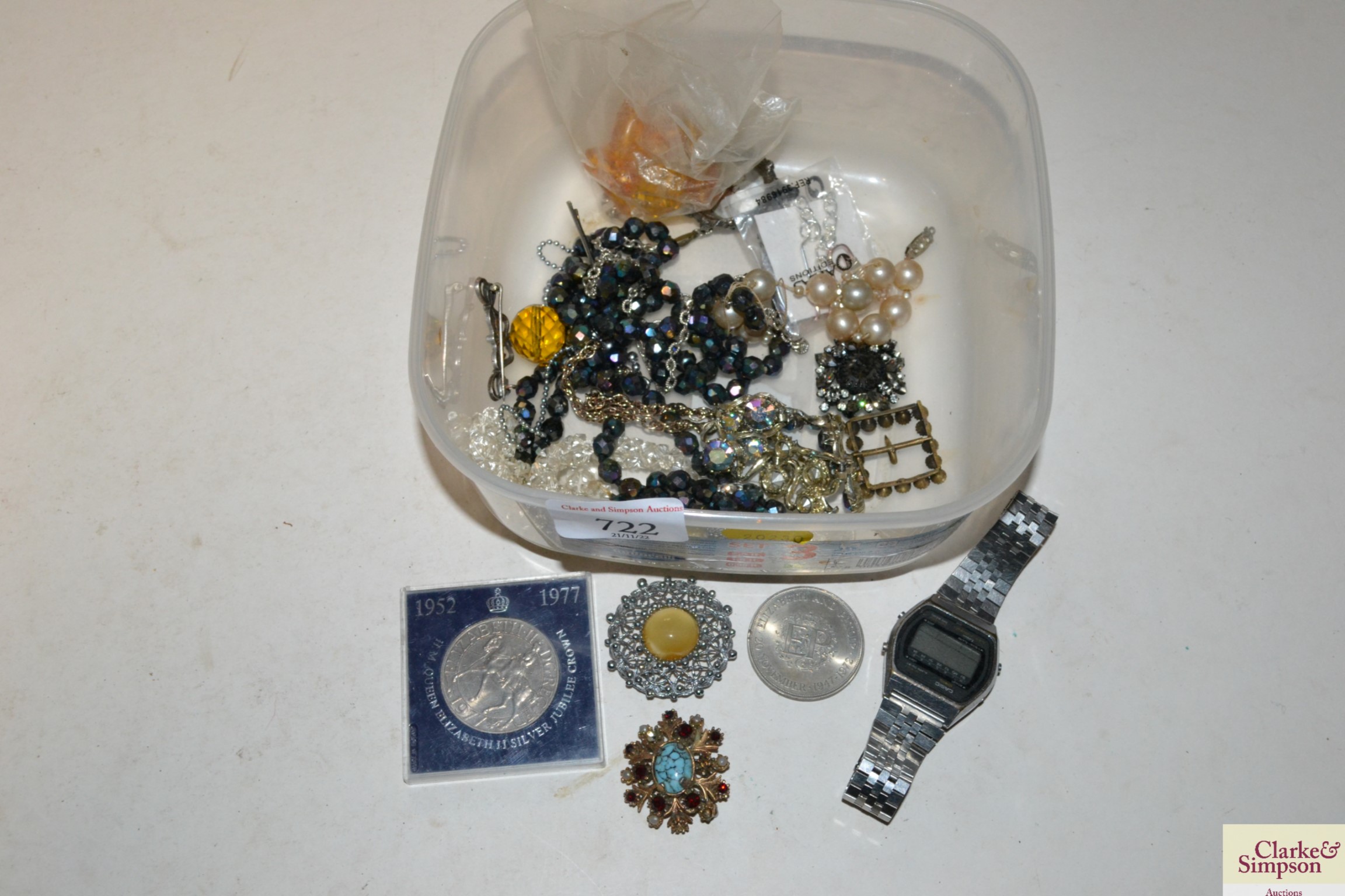 A box containing various costume jewellery and coi