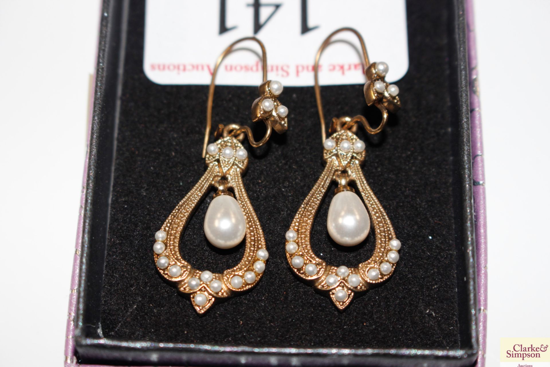 A pair of yellow metal and pearl set ear-rings