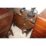 An antique oak gateleg table