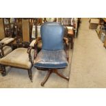 A blue leather swivel office chair