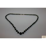 A boxed Malecite beaded necklace