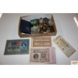 A box of various coinage and bank notes