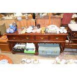 A mahogany sideboard fitted four drawers