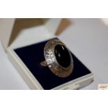 A large silver and black onyx dress ring, size T/U