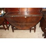 An antique oak gateleg table