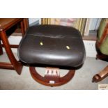 A faux leather footstool