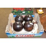 A set of four Taylor Rolph of London bowling woods