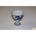 A Chinese blue and white dragon decorated stem cup