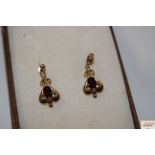 A pair of 9ct gold garnet set ear-rings