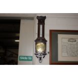 An oak cased CSSA Limited London aneroid barometer