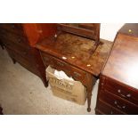 An antique oak lowboy fitted three drawers