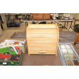 A beech bread bin with tambour front