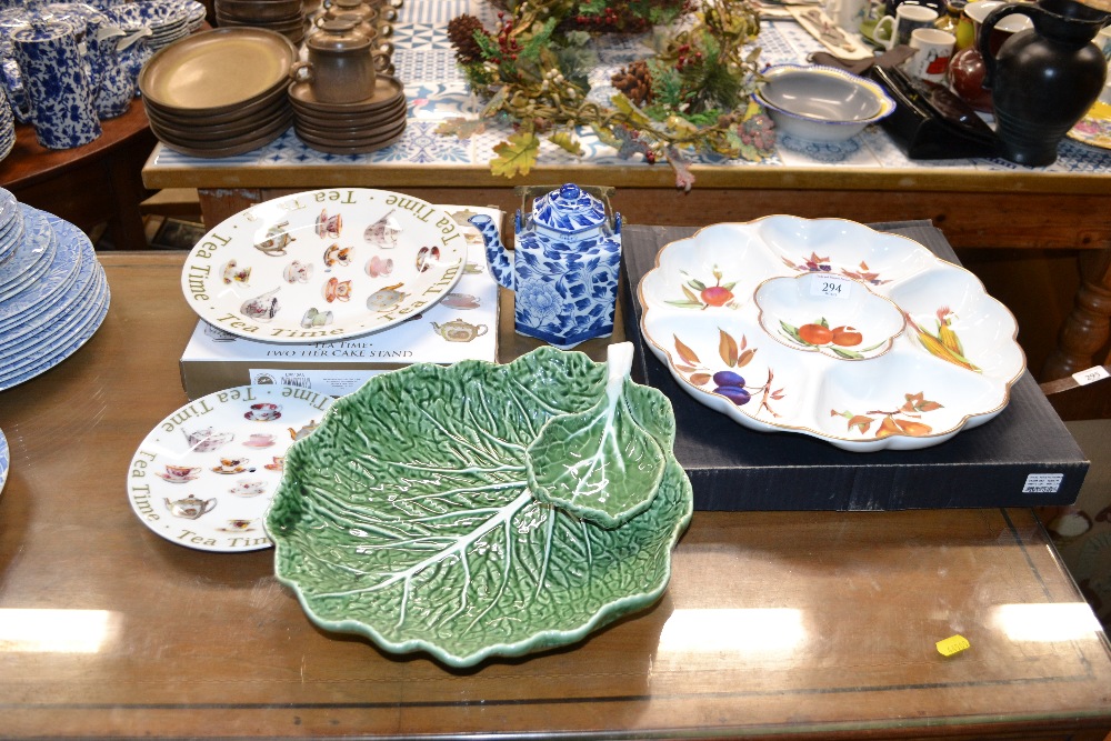 A leaf plate together with a two tier cake stand,