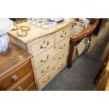 An antique stripped pine chest fitted two short ov