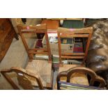 A pair of oak and rush seated chairs (number to th