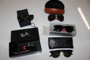 A box of sunglasses to include Ray Bans, some AF