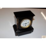 A late Victorian black slate mantle clock by Tree
