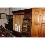 A Victorian mirror fronted wardrobe fitted two dra