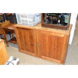 A pine two door cupboard fitted three drawers to i