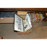 A box containing various books and pictures