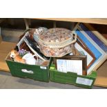 Two boxes containing various pictures and prints;