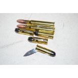 Six penknives in the form of bullets (74)