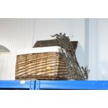 A wicker basket; wicker place mats and a wrought i
