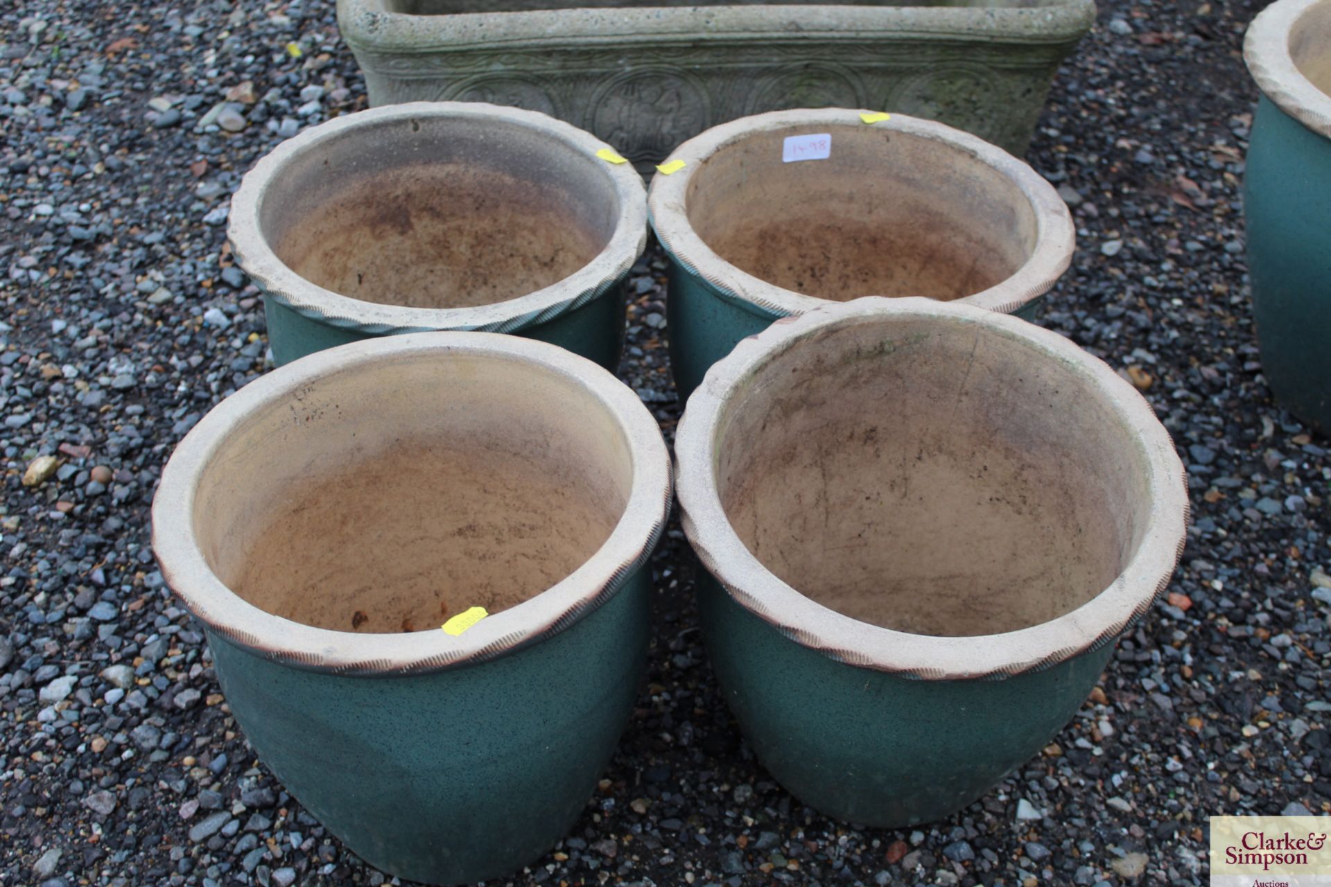 A set of four blue glazed plant pots, approximatel