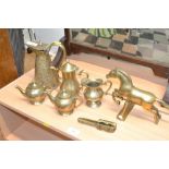 A collection of brass items to include nutcrackers