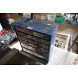 A small metal workshop cabinet with contents of va