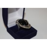 A large black onyx and .925 dress ring