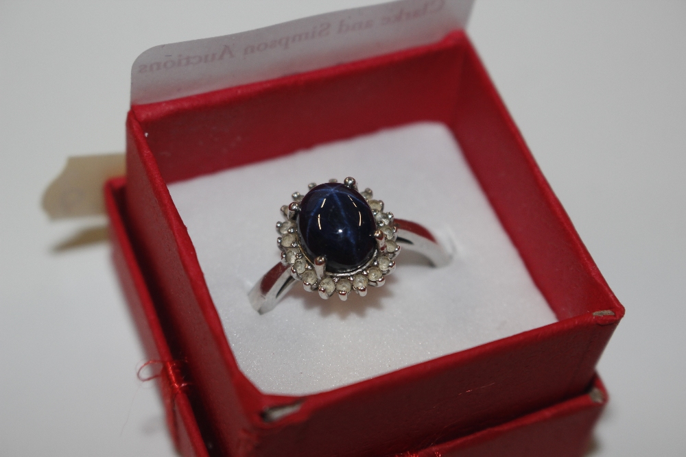 A TGGC sterling silver and diamond and sapphire ri
