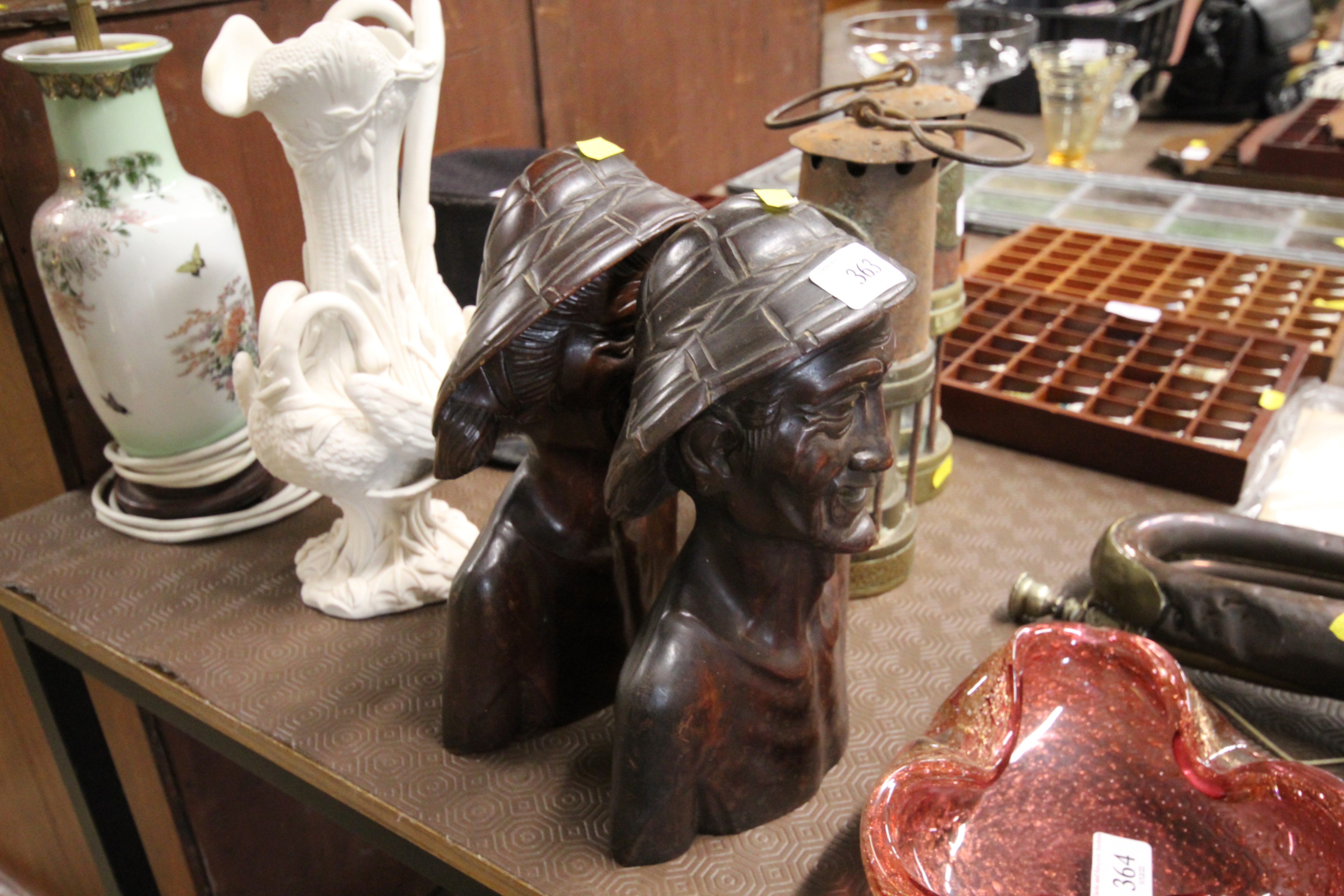 Two carved Oriental hardwood busts