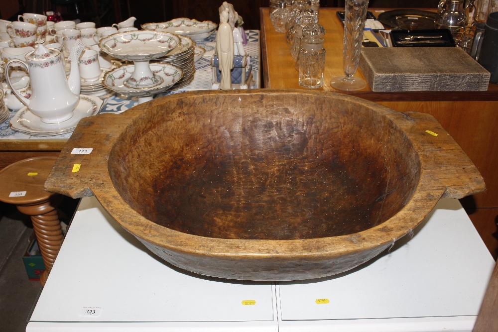 A large rustic wooden bowl