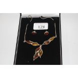 A vintage sterling silver and amber necklace and e