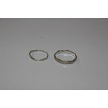 Two white metal rings