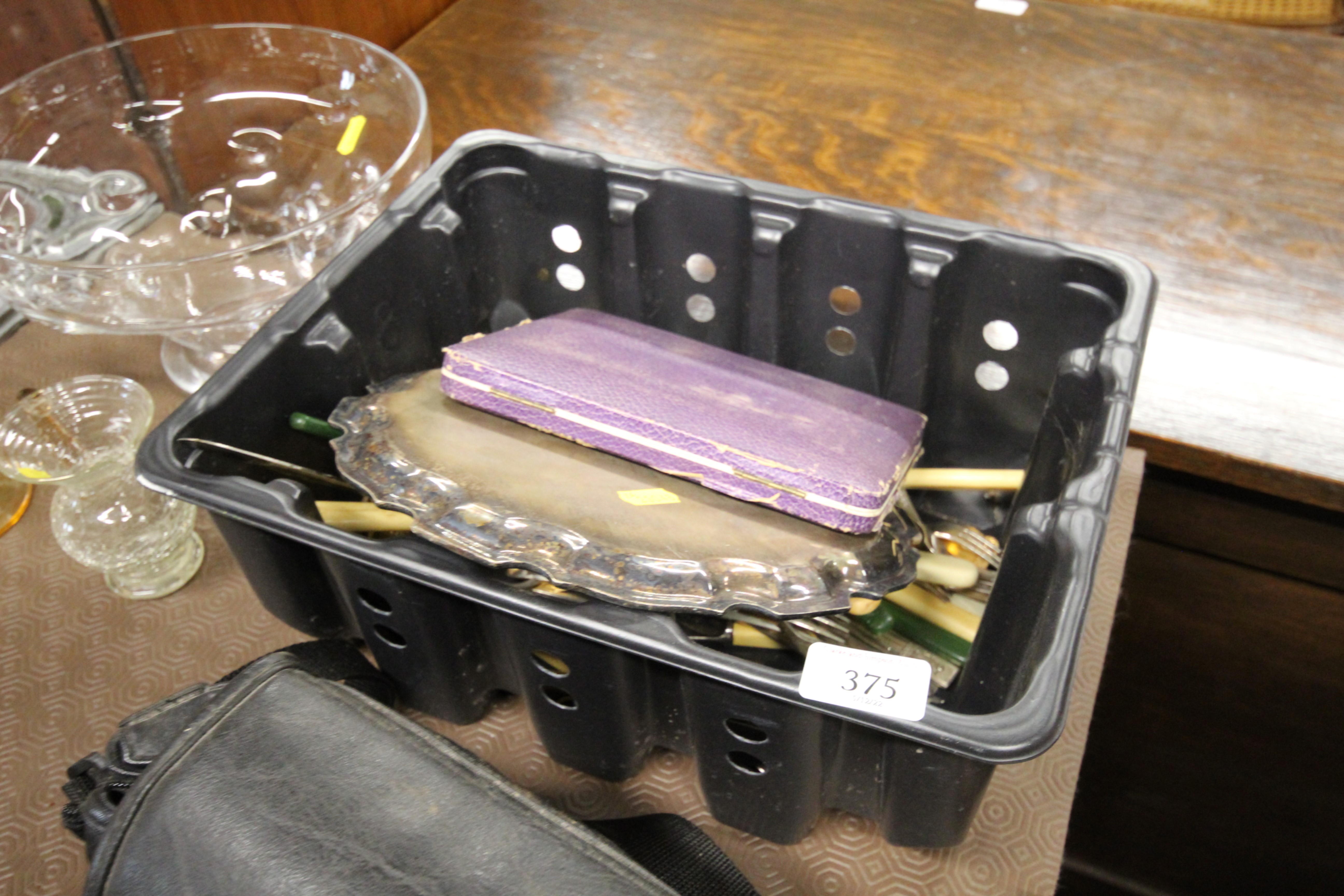 A box of cutlery including cased silver handled kn