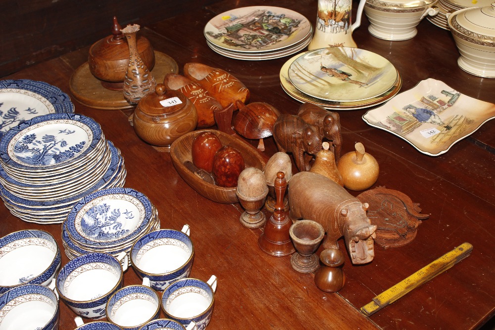 A collection of wooden ware to include carved anim