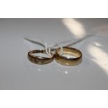 A 9ct gold wedding band, 3.2g together with a 9ct gold ring set three white stones, 1.2g