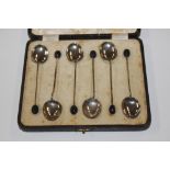 A set of six cased silver bean top coffee spoons