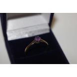 A 9ct gold and amethyst set ring
