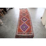 An approx. 10'3" x 2'5" Kelim runner