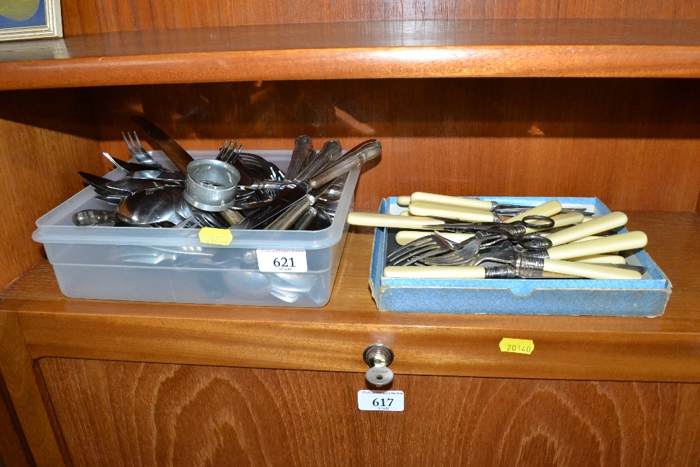 Two boxes containing various cutlery including fis