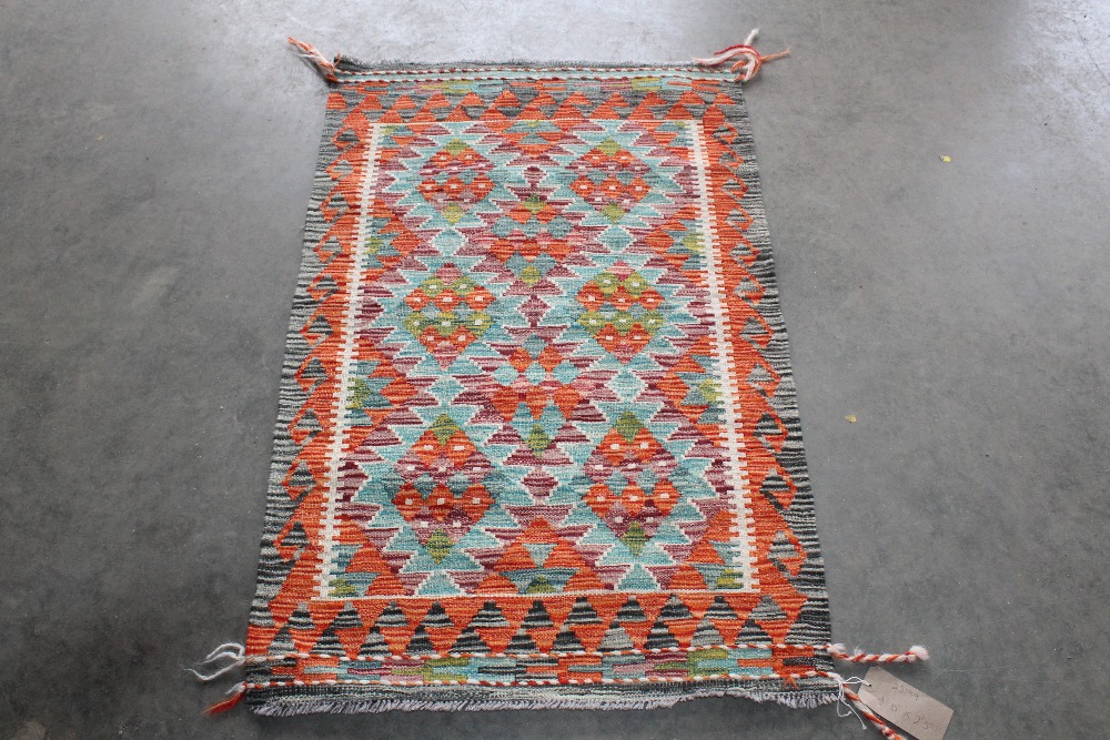 An approx. 4' x 2'5" Chobi Kelim rug