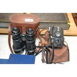 An Ensign camera and a pair of binoculars with a c